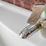 hard water and water softener necessary - stained faucet handle